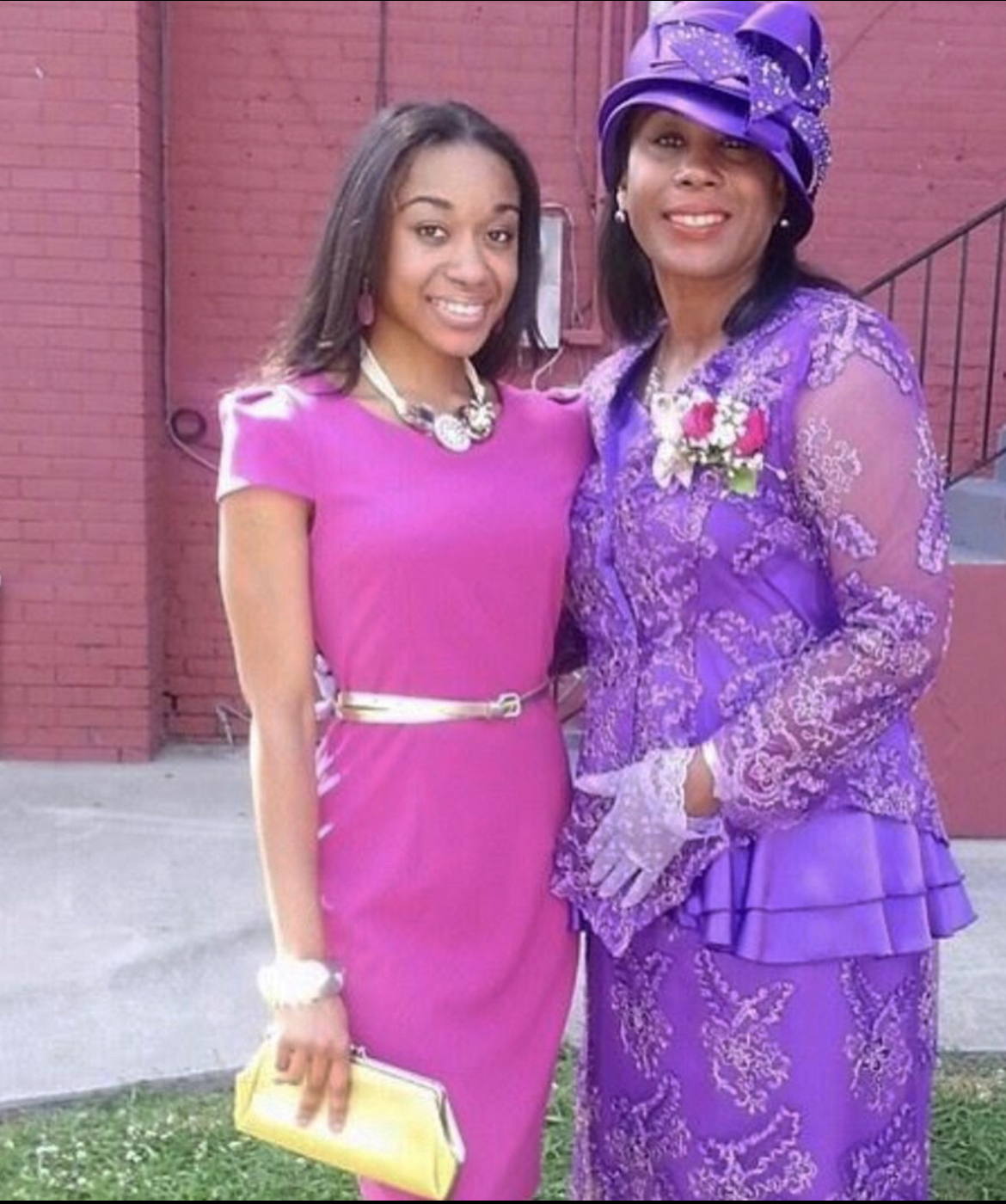 Mary Kingcannon in a purple suit and hat with her daughter
